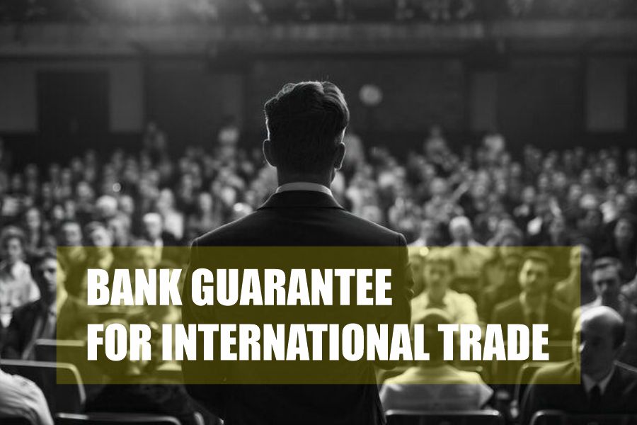 professional speaker presenting to a large business audience on trade finance and bank guarantees